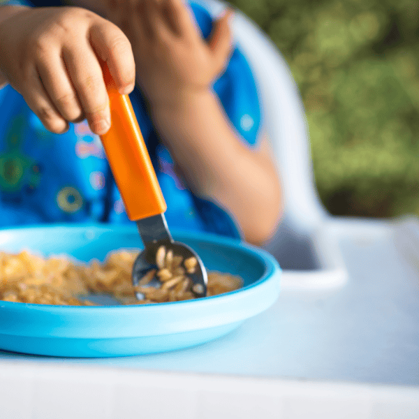 Child showing fussy eating behaviour at mealtime with healthy food options, supported by Gold Coast dietitian services